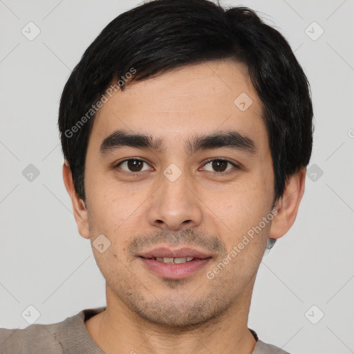 Joyful white young-adult male with short  black hair and brown eyes