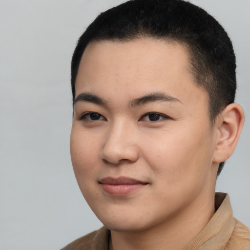 Joyful latino young-adult male with short  brown hair and brown eyes