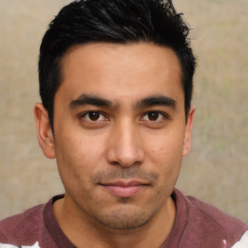 Joyful asian young-adult male with short  brown hair and brown eyes
