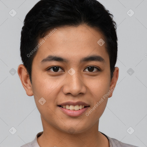 Joyful latino young-adult male with short  black hair and brown eyes