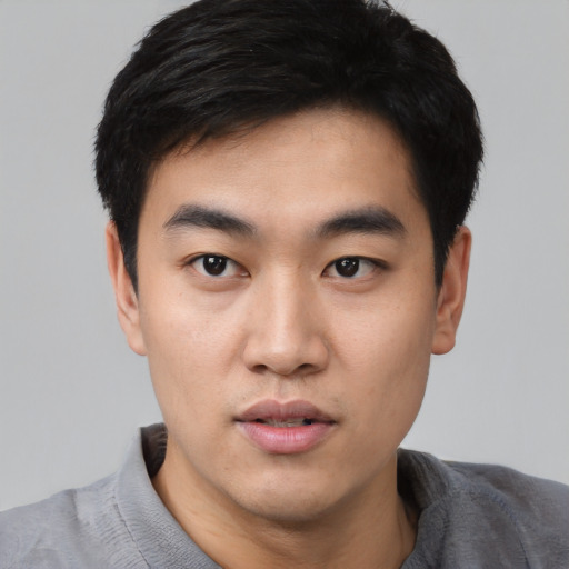 Neutral asian young-adult male with short  black hair and brown eyes