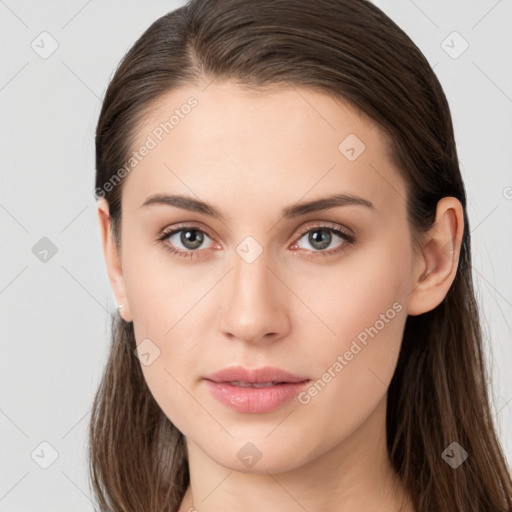 Neutral white young-adult female with long  brown hair and brown eyes