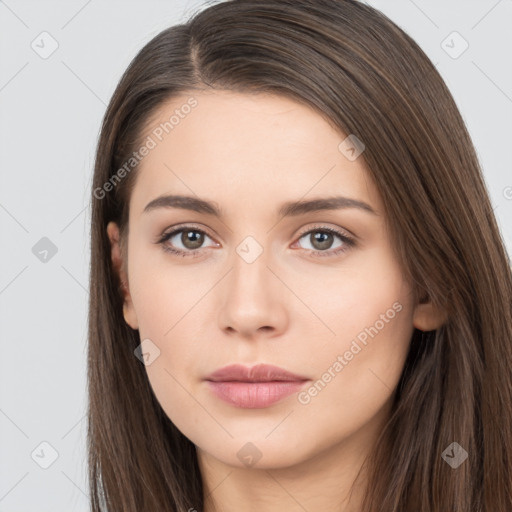 Neutral white young-adult female with long  brown hair and brown eyes