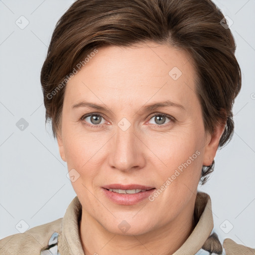 Joyful white adult female with medium  brown hair and grey eyes