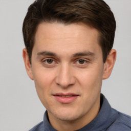 Joyful white young-adult male with short  brown hair and brown eyes