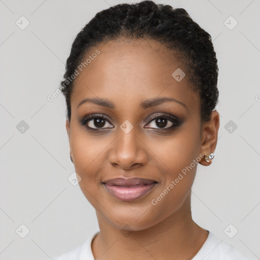 Joyful black young-adult female with short  brown hair and brown eyes