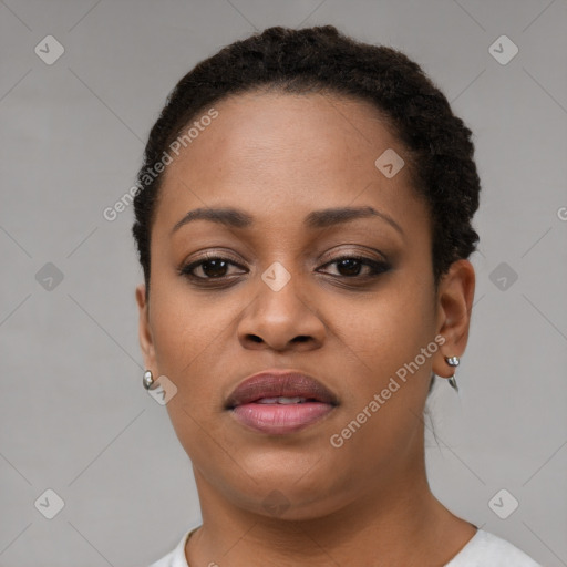 Joyful black young-adult female with short  brown hair and brown eyes