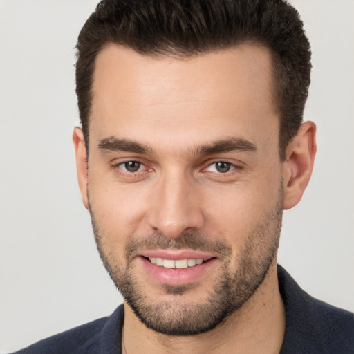 Joyful white young-adult male with short  brown hair and brown eyes