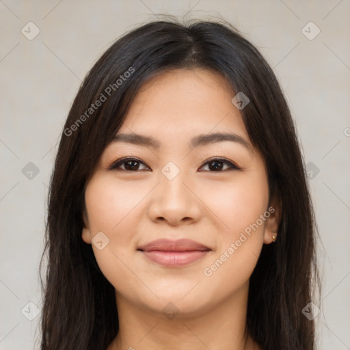 Joyful latino young-adult female with long  brown hair and brown eyes