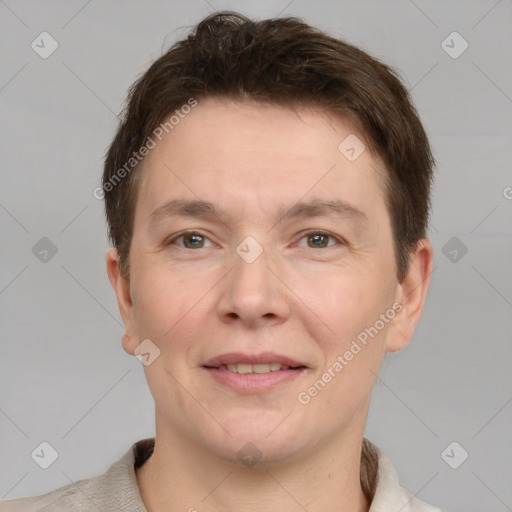 Joyful white adult male with short  brown hair and grey eyes