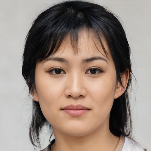 Neutral asian young-adult female with medium  black hair and brown eyes
