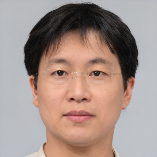 Neutral asian adult male with short  brown hair and brown eyes
