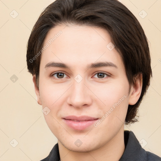 Joyful white young-adult female with short  brown hair and brown eyes