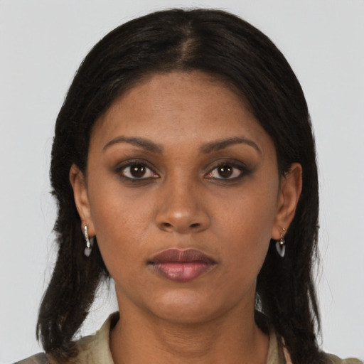 Neutral black young-adult female with medium  brown hair and brown eyes