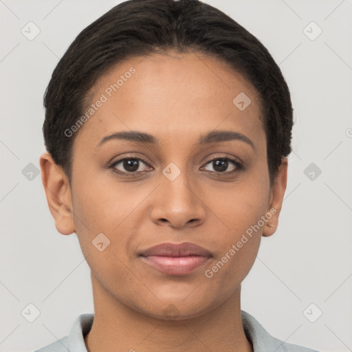 Joyful latino young-adult female with short  brown hair and brown eyes