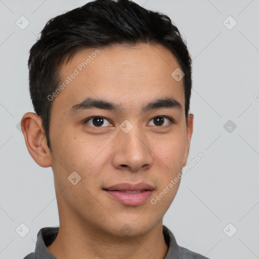 Joyful asian young-adult male with short  brown hair and brown eyes