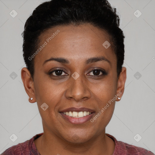 Joyful black young-adult female with short  brown hair and brown eyes