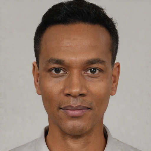 Neutral black young-adult male with short  black hair and brown eyes