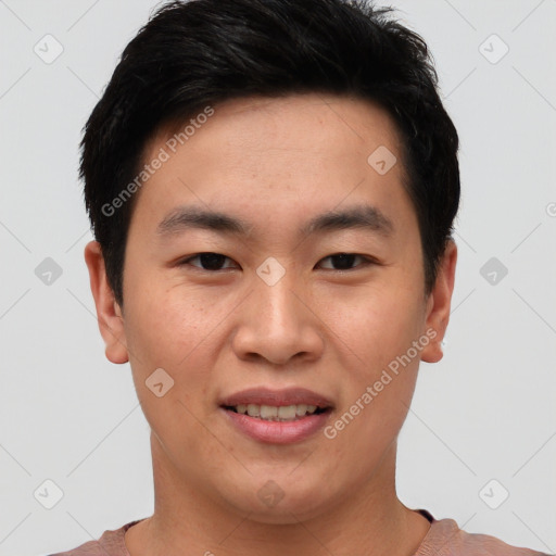 Joyful asian young-adult male with short  brown hair and brown eyes