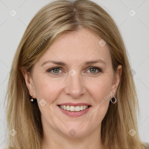 Joyful white adult female with long  brown hair and grey eyes