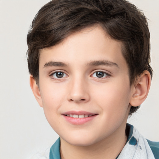 Joyful white child male with short  brown hair and brown eyes