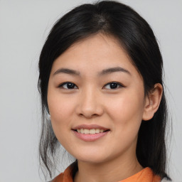 Joyful asian young-adult female with medium  brown hair and brown eyes