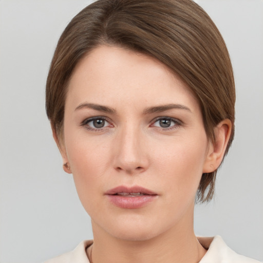 Neutral white young-adult female with short  brown hair and brown eyes