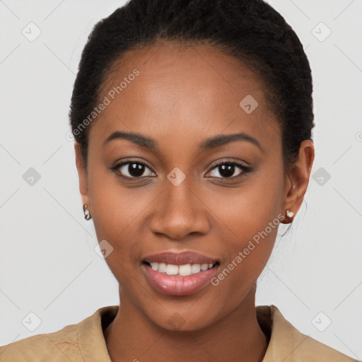 Joyful black young-adult female with short  brown hair and brown eyes