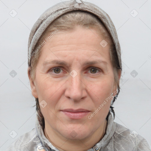 Joyful white adult female with short  brown hair and grey eyes