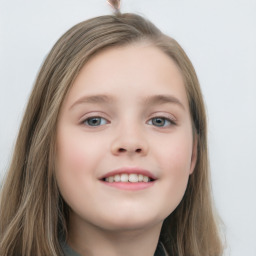 Joyful white child female with long  brown hair and blue eyes