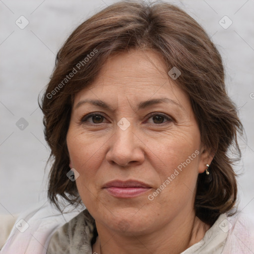 Joyful white adult female with medium  brown hair and brown eyes