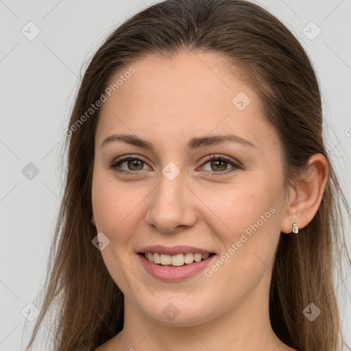 Joyful white young-adult female with long  brown hair and grey eyes