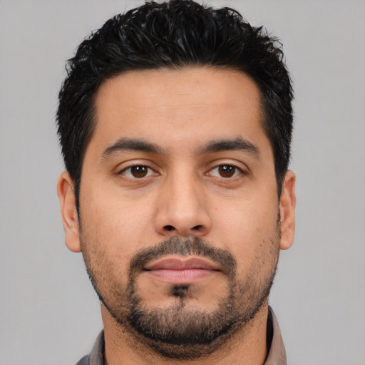Neutral latino young-adult male with short  black hair and brown eyes
