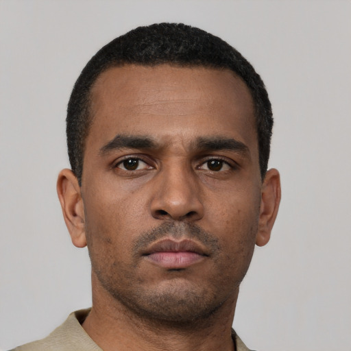 Neutral latino young-adult male with short  brown hair and brown eyes