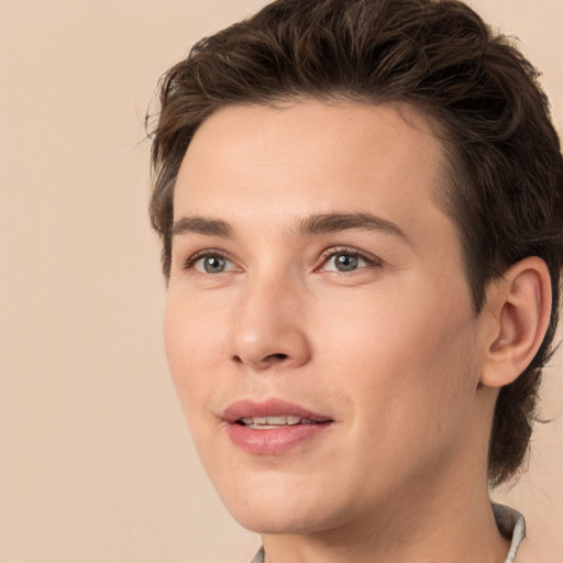 Joyful white young-adult male with medium  brown hair and brown eyes