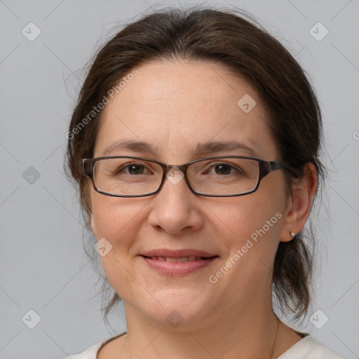 Joyful white adult female with medium  brown hair and brown eyes