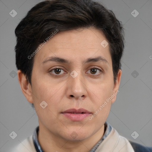 Joyful white adult female with short  brown hair and brown eyes