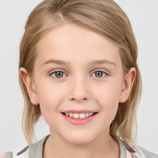 Joyful white child female with medium  brown hair and blue eyes