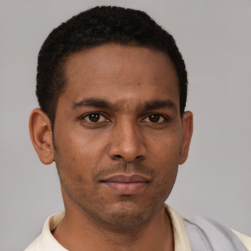 Neutral latino young-adult male with short  brown hair and brown eyes