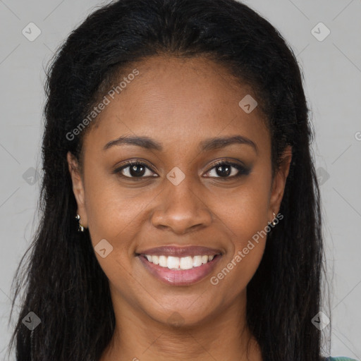 Joyful black young-adult female with long  brown hair and brown eyes