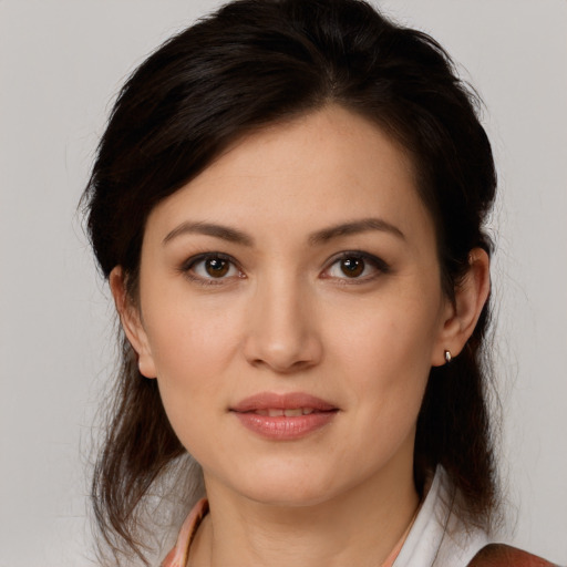 Joyful white young-adult female with medium  brown hair and brown eyes