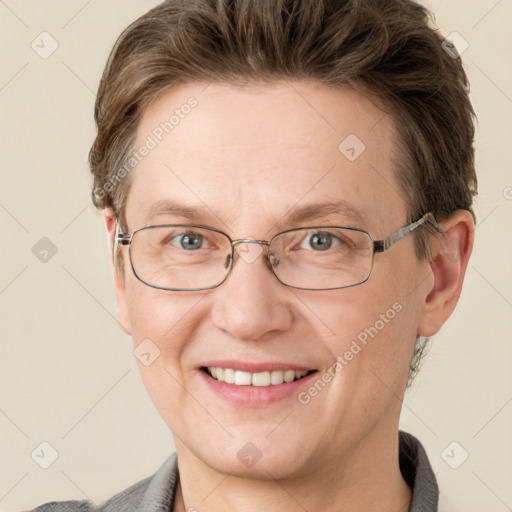 Joyful white adult male with short  brown hair and grey eyes