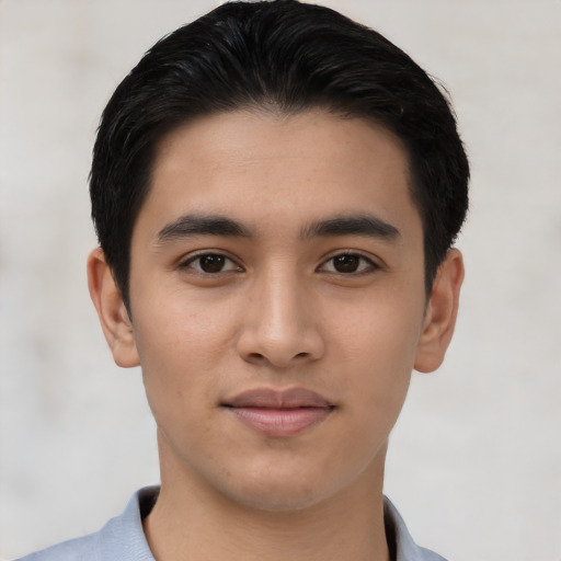 Joyful asian young-adult male with short  black hair and brown eyes