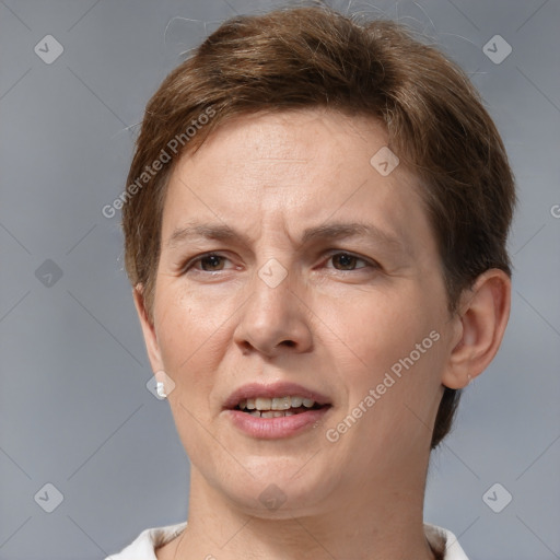 Joyful white adult female with short  brown hair and grey eyes