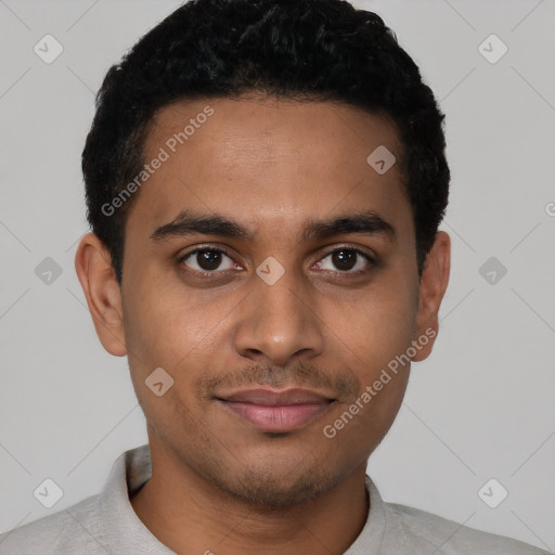 Joyful latino young-adult male with short  black hair and brown eyes