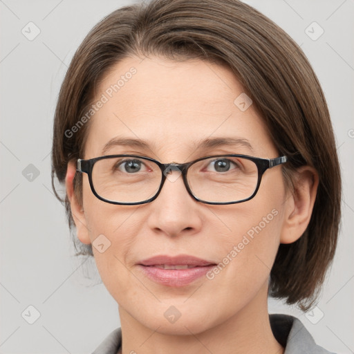 Joyful white adult female with medium  brown hair and grey eyes