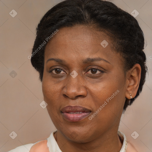 Joyful black adult female with short  brown hair and brown eyes