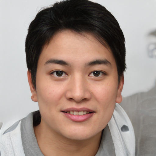 Joyful asian young-adult female with short  brown hair and brown eyes