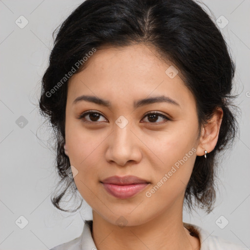 Joyful latino young-adult female with medium  brown hair and brown eyes