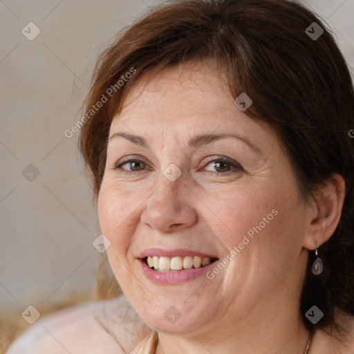 Joyful white adult female with medium  brown hair and brown eyes